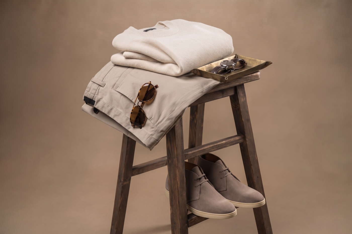 Garment, sunglasses and watch styled for a fashion shoot